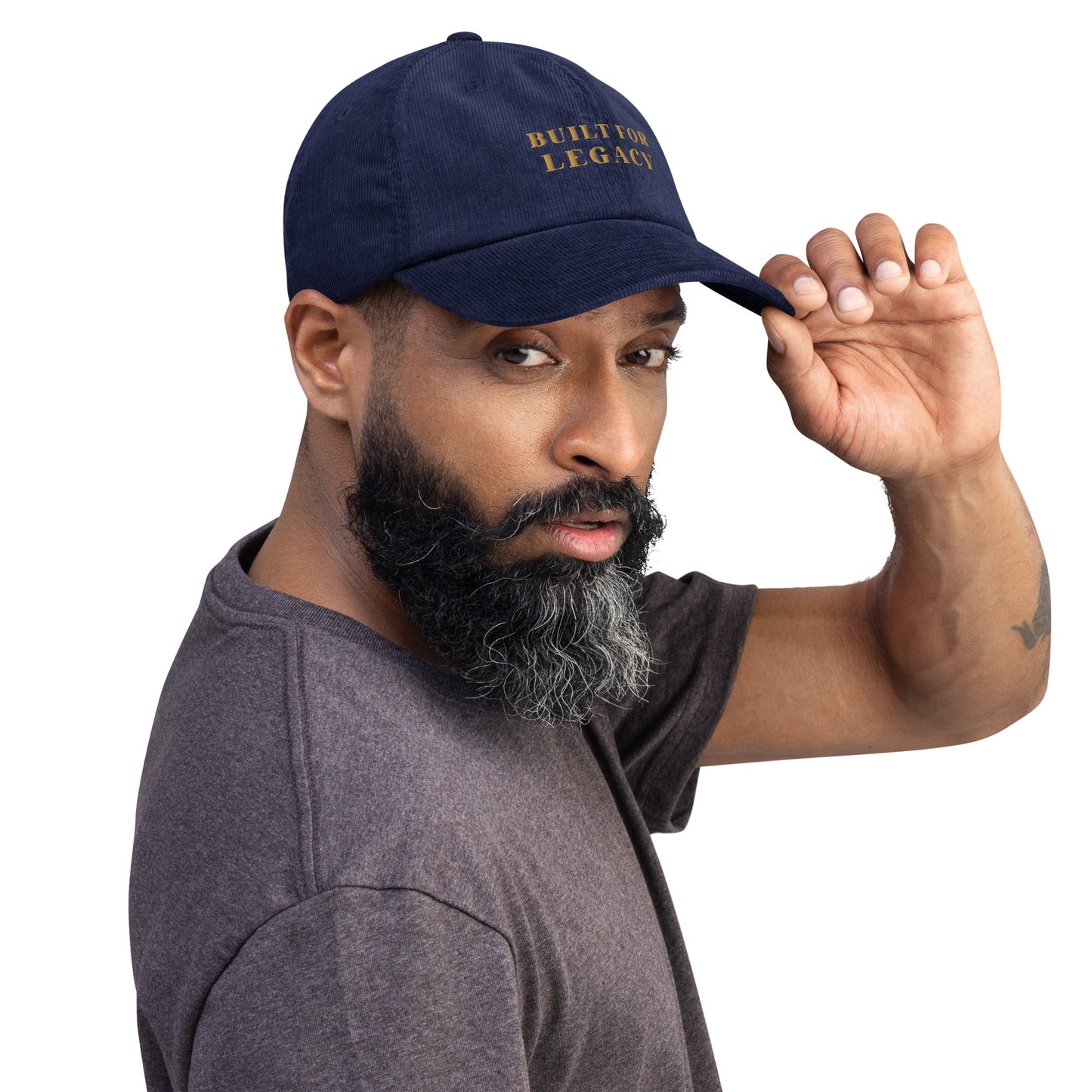 Oxford navy corduroy heritage hat with “BUILT FOR LEGACY” embroidery, worn and tilted back