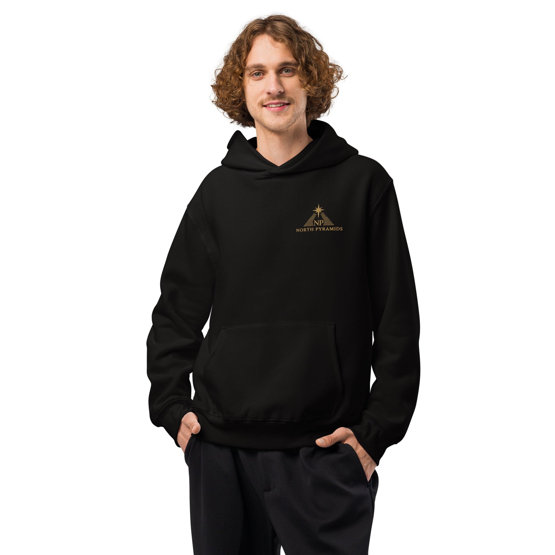 Black oversized hoodie with hood, front kangaroo pocket, and North Pyramids chest logo.