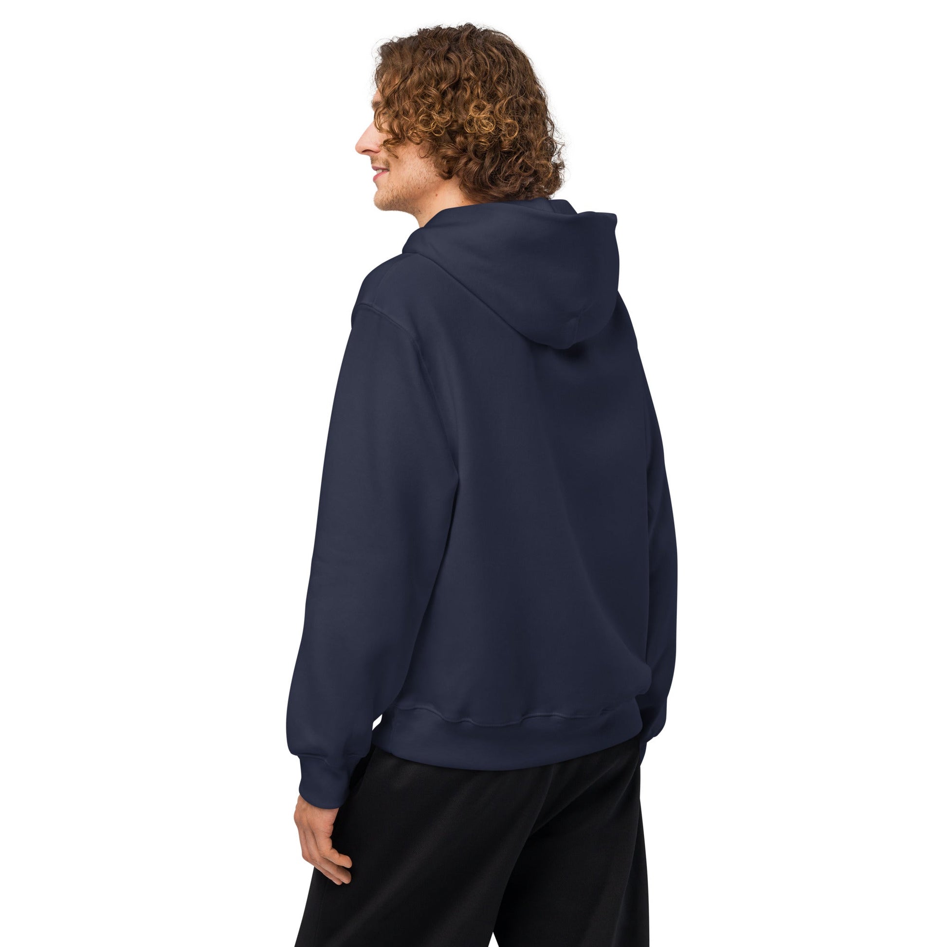 Navy oversized hoodie shown from the side, with hood and full-length sleeves.