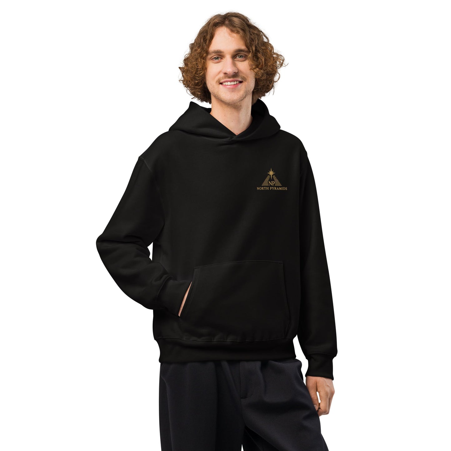 Black oversized hoodie with hood, kangaroo pocket, visible drawstring tips, and chest logo.