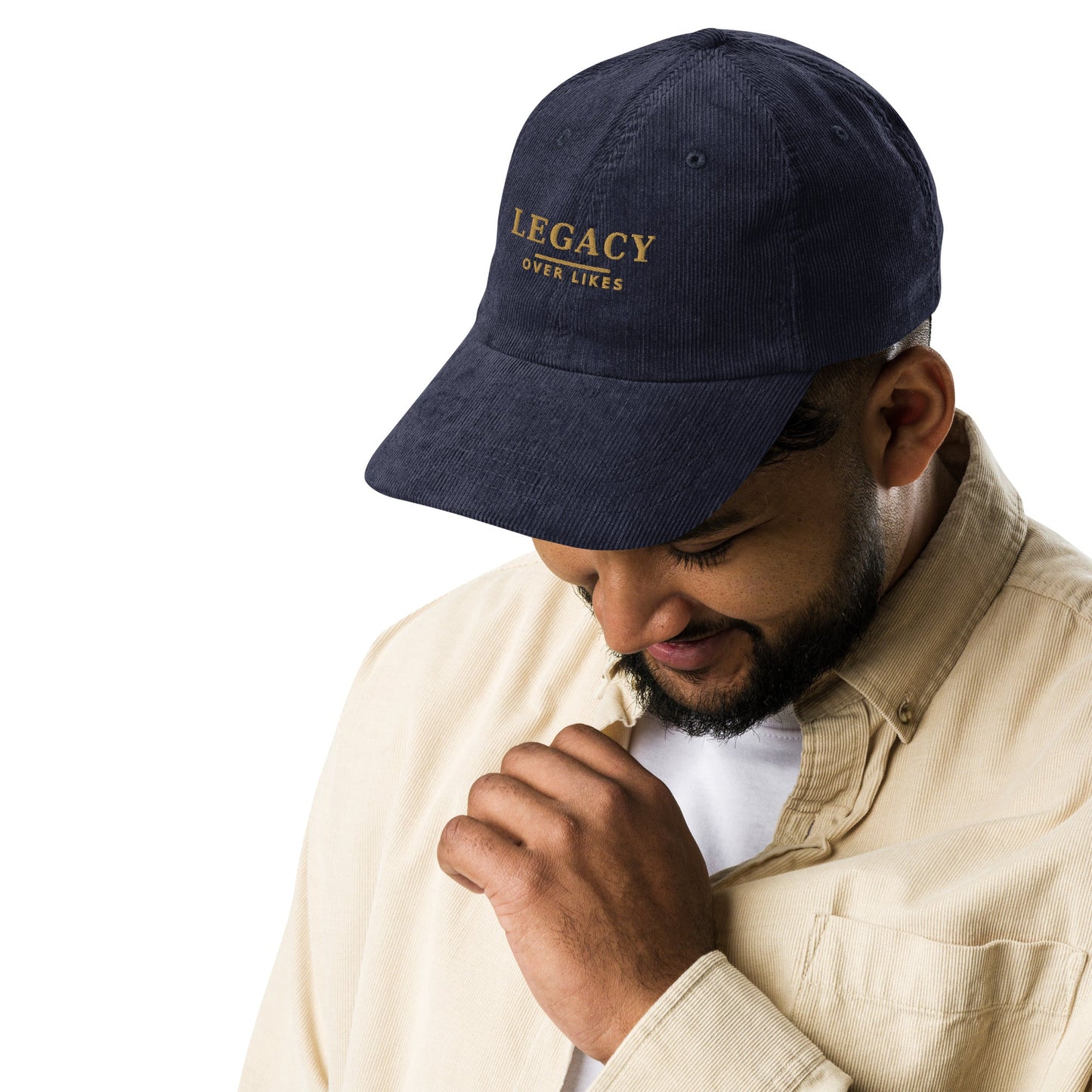 Navy corduroy cap with embroidered “LEGACY” lettering on the front panel.