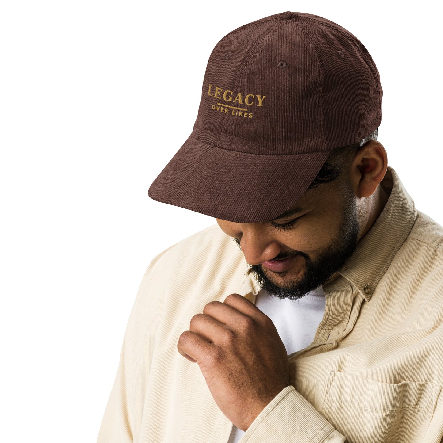 Brown corduroy cap with embroidered “LEGACY” lettering on the front panel.