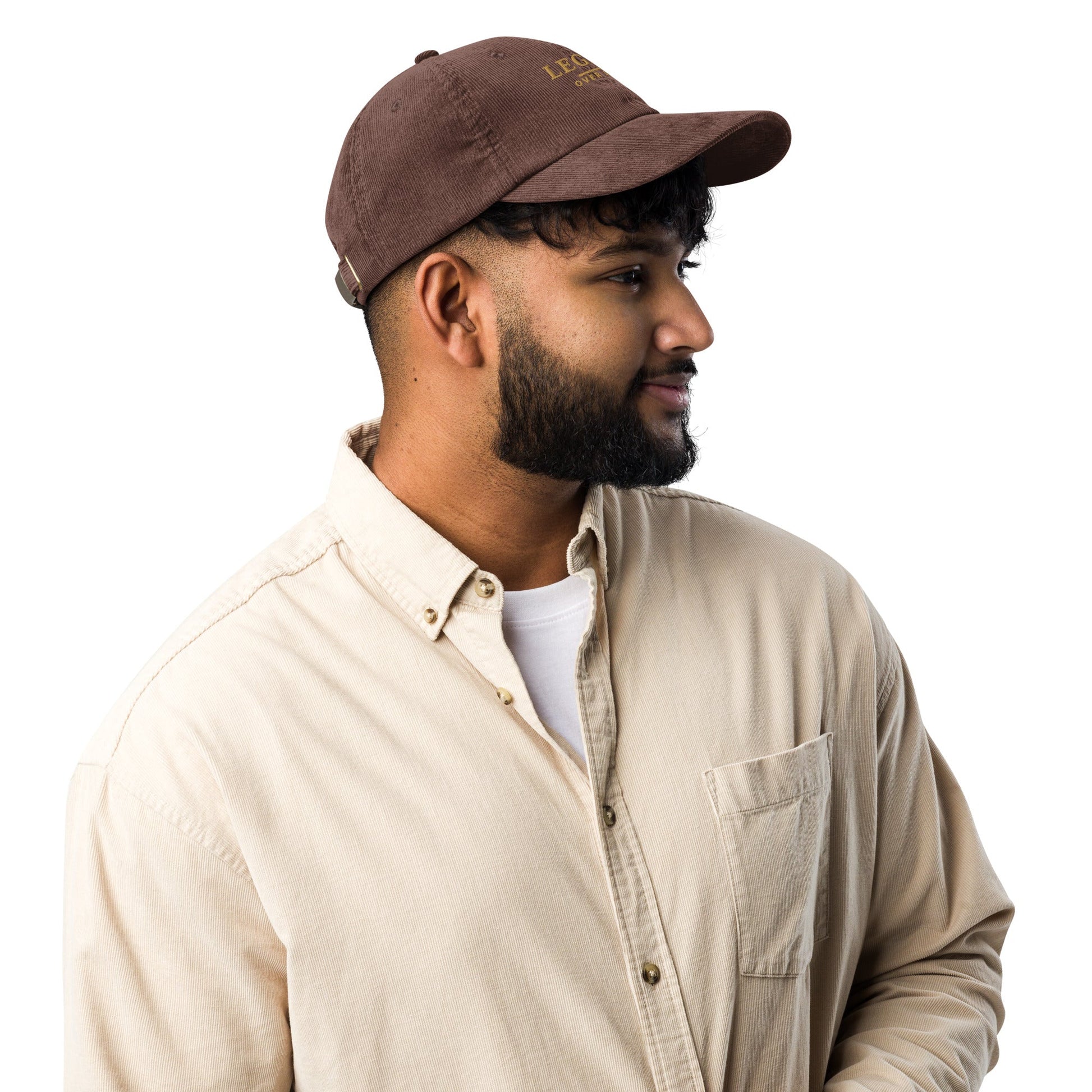 Brown corduroy baseball cap, side profile with short brim and stitched eyelets.