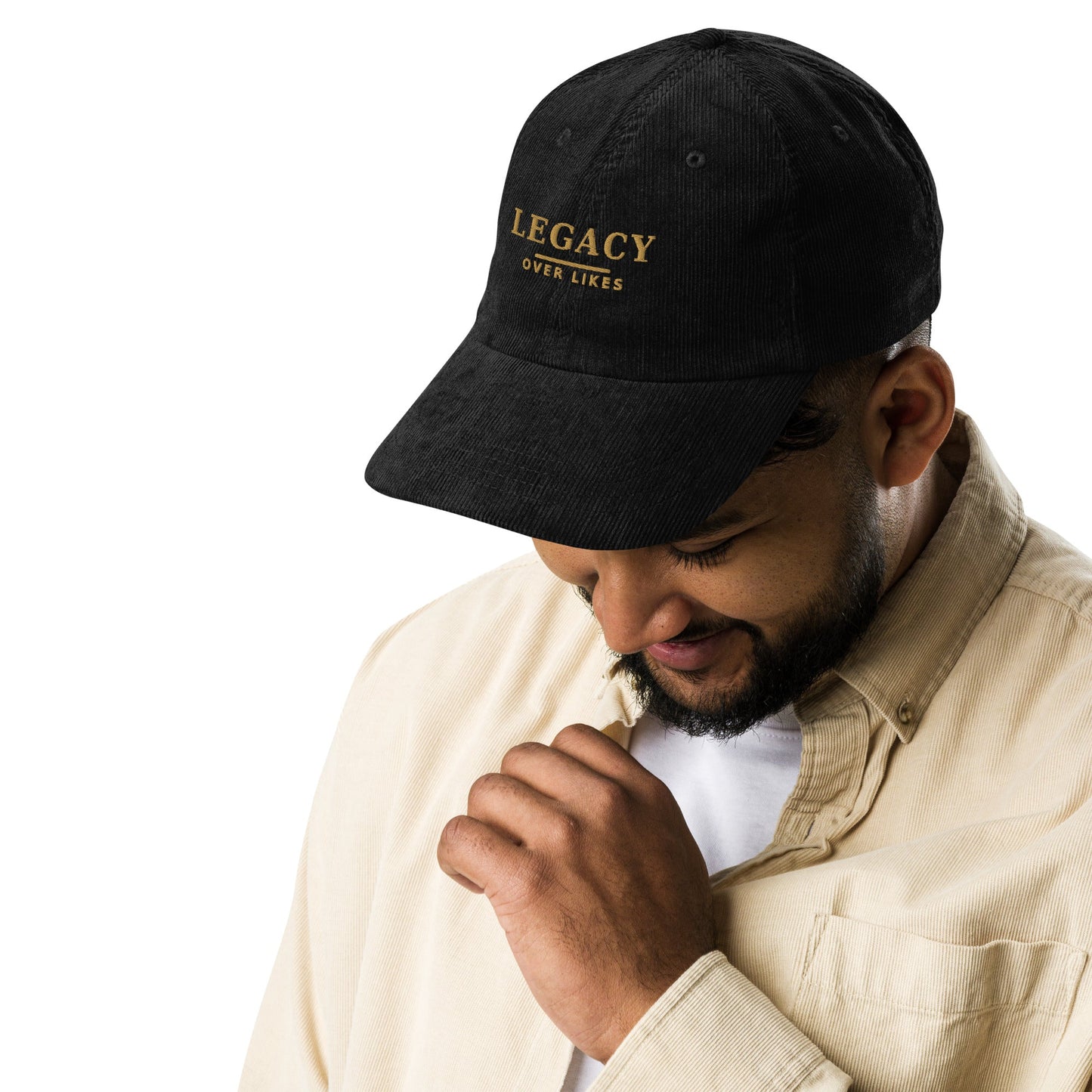 Black corduroy cap with embroidered “LEGACY” lettering on the front panel.