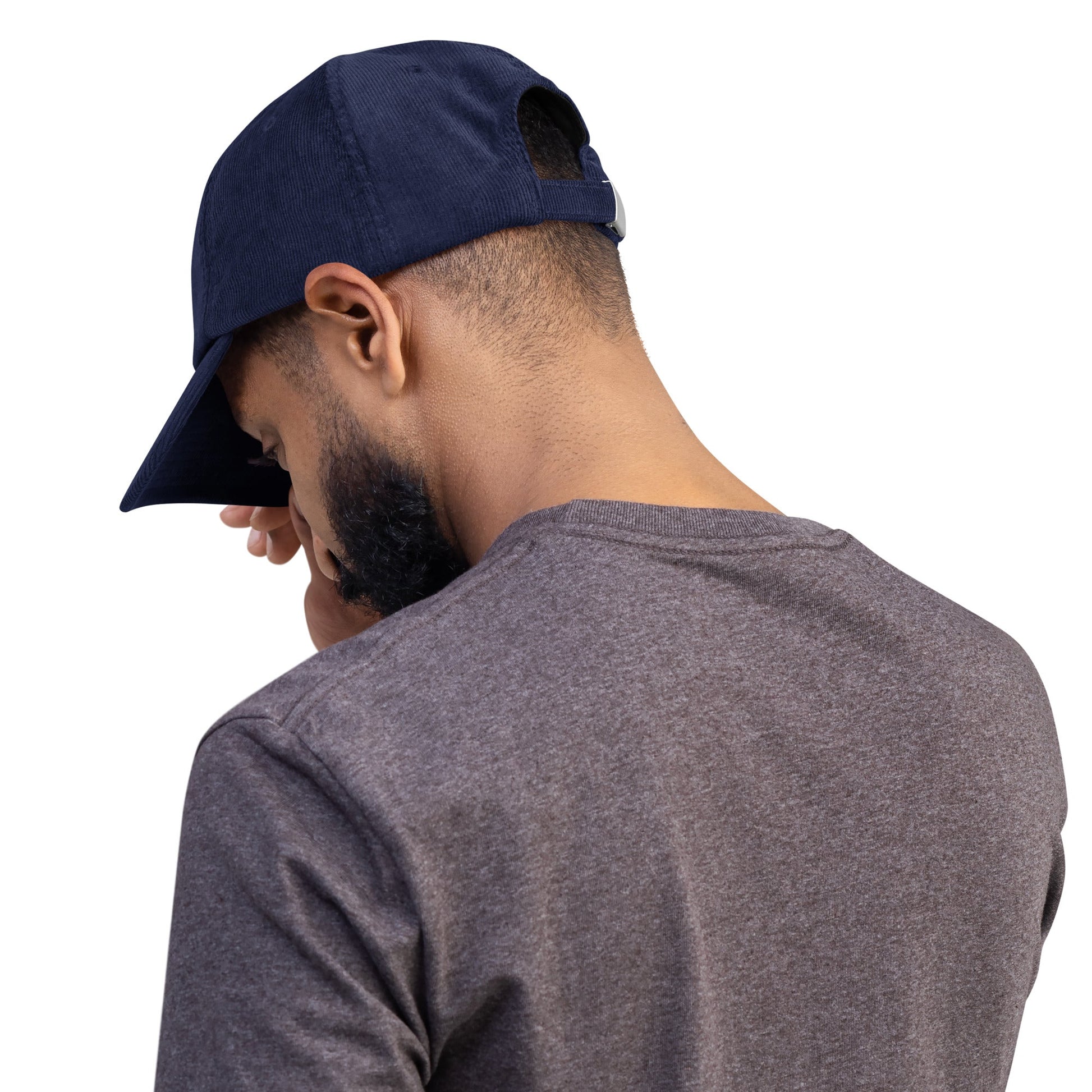 Oxford navy corduroy heritage hat shown from the side with “BUILT FOR LEGACY” on front