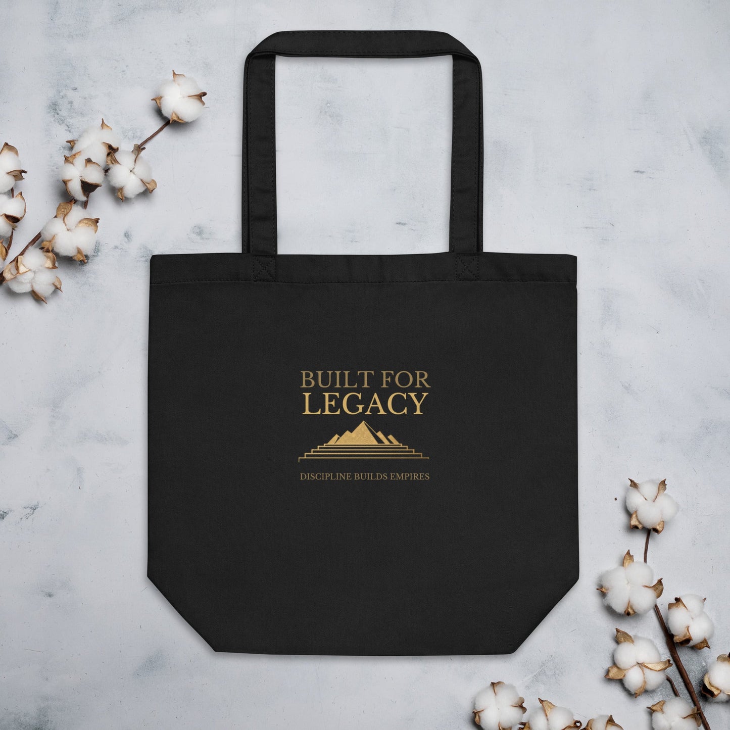 Black tote bag with “Built for Legacy” front lettering and top handles