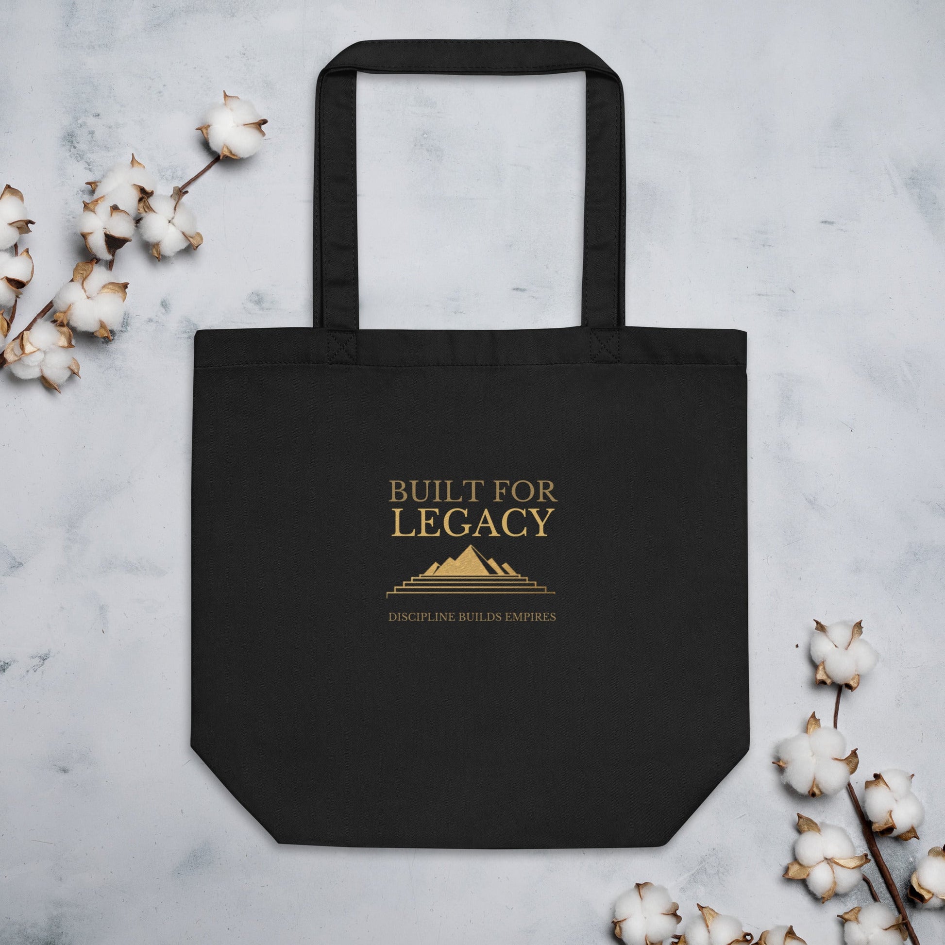 Black tote bag with “Built for Legacy” front lettering and top handles