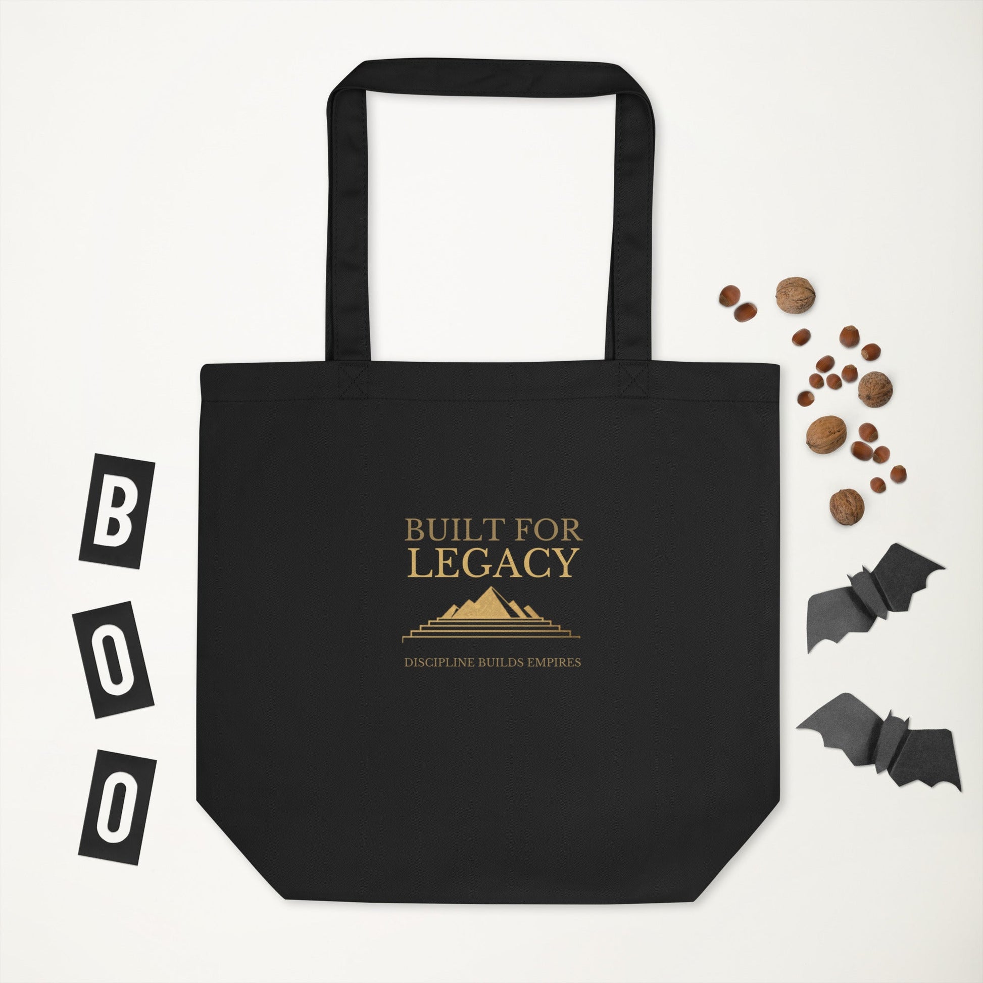 Black tote bag with “Built for Legacy” print, wide base and top handles