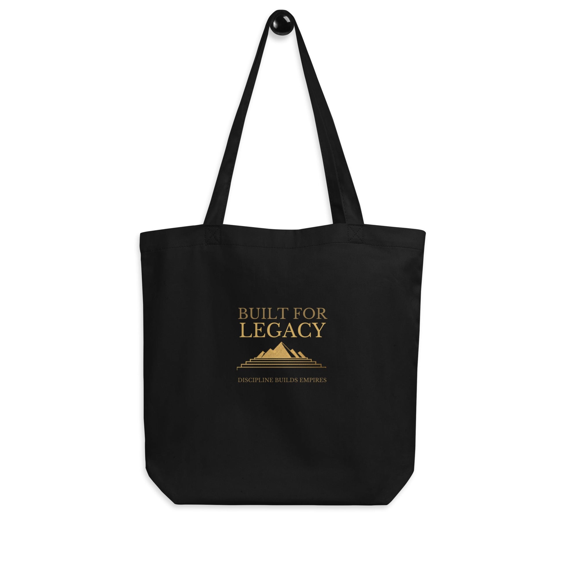 Black tote bag with two long top handles and “Built for Legacy” front text