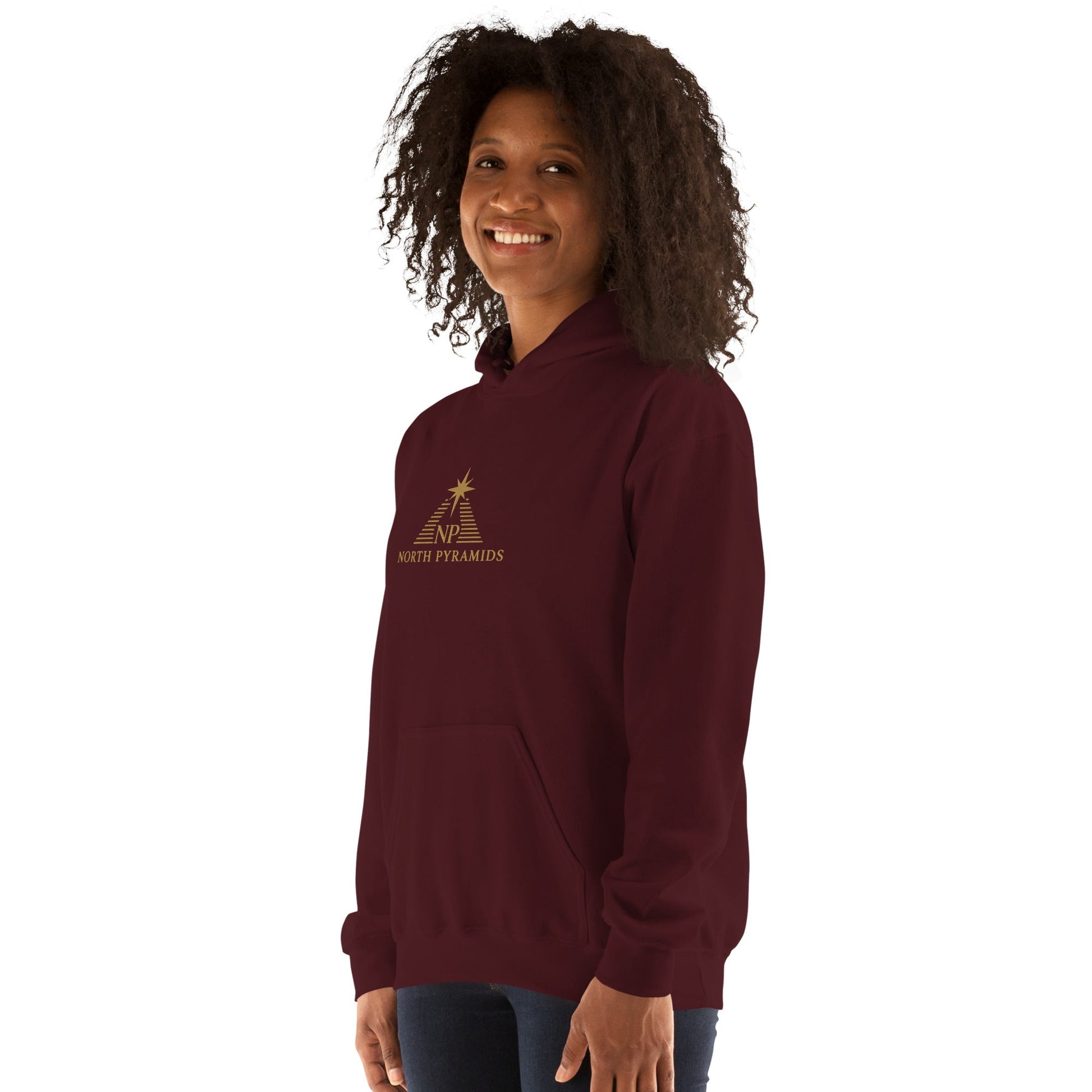 Unisex heavy blend hoodie in maroon, three-quarter front view with North Pyramids logo