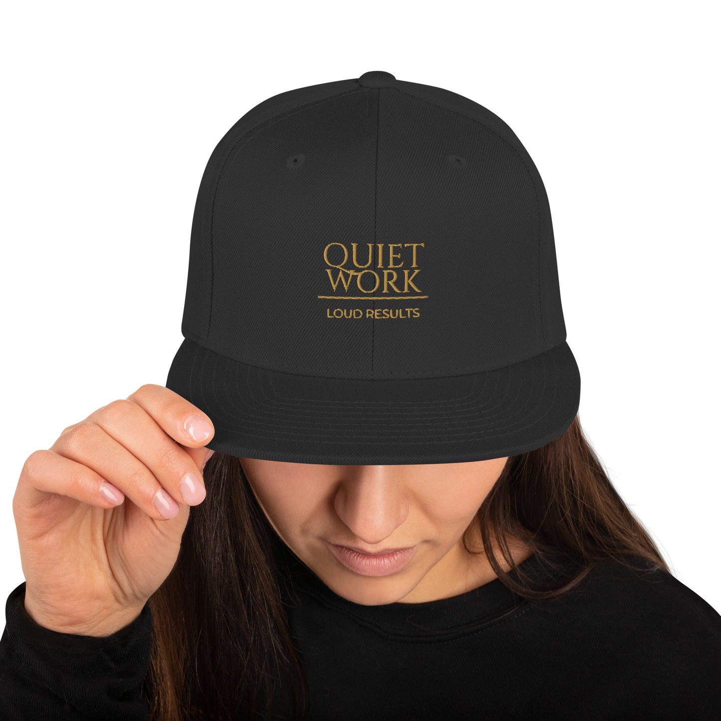 Black snapback cap with "QUIET WORK" logo and "LOUD RESULTS"
