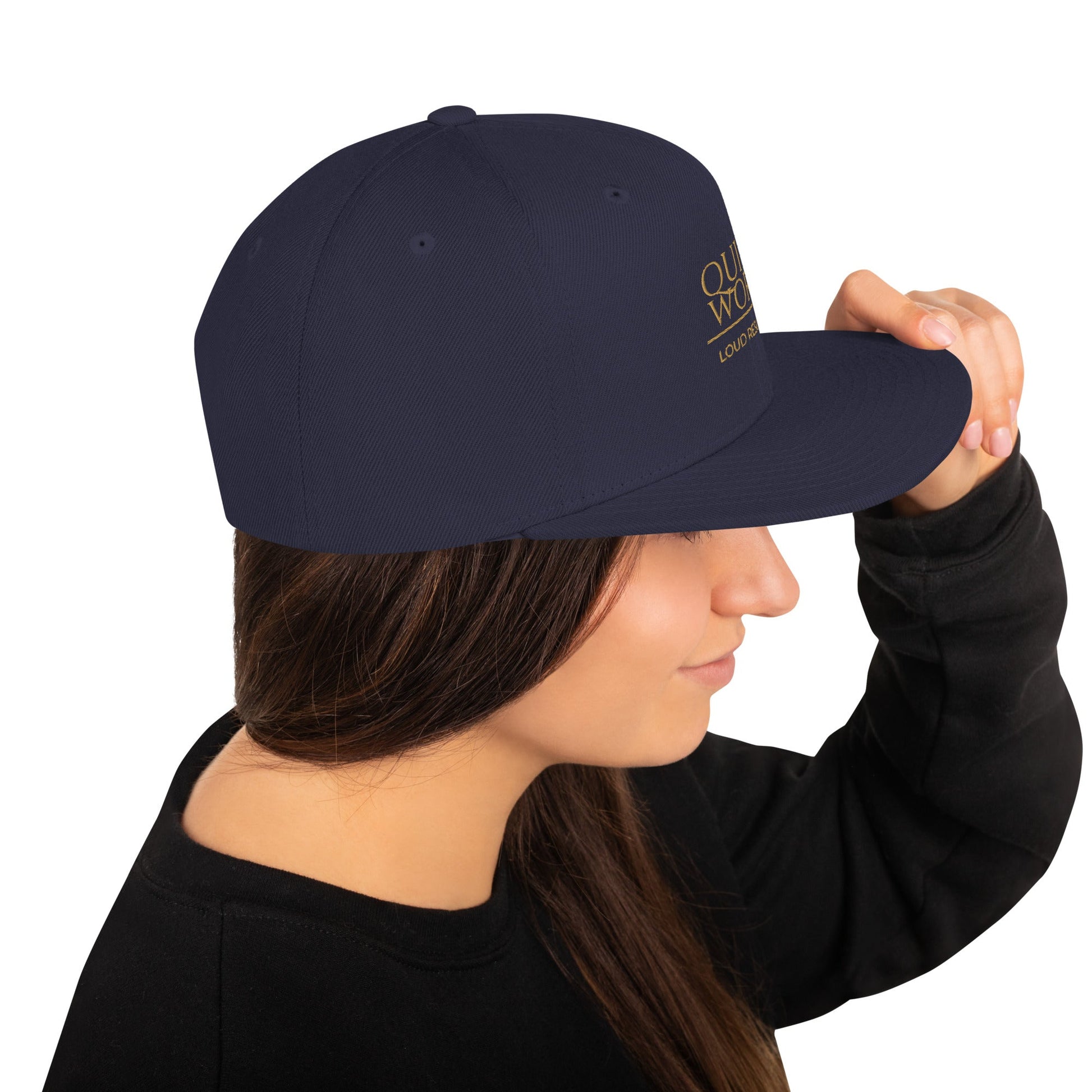 Navy snapback cap with curved brim and right-side logo patch