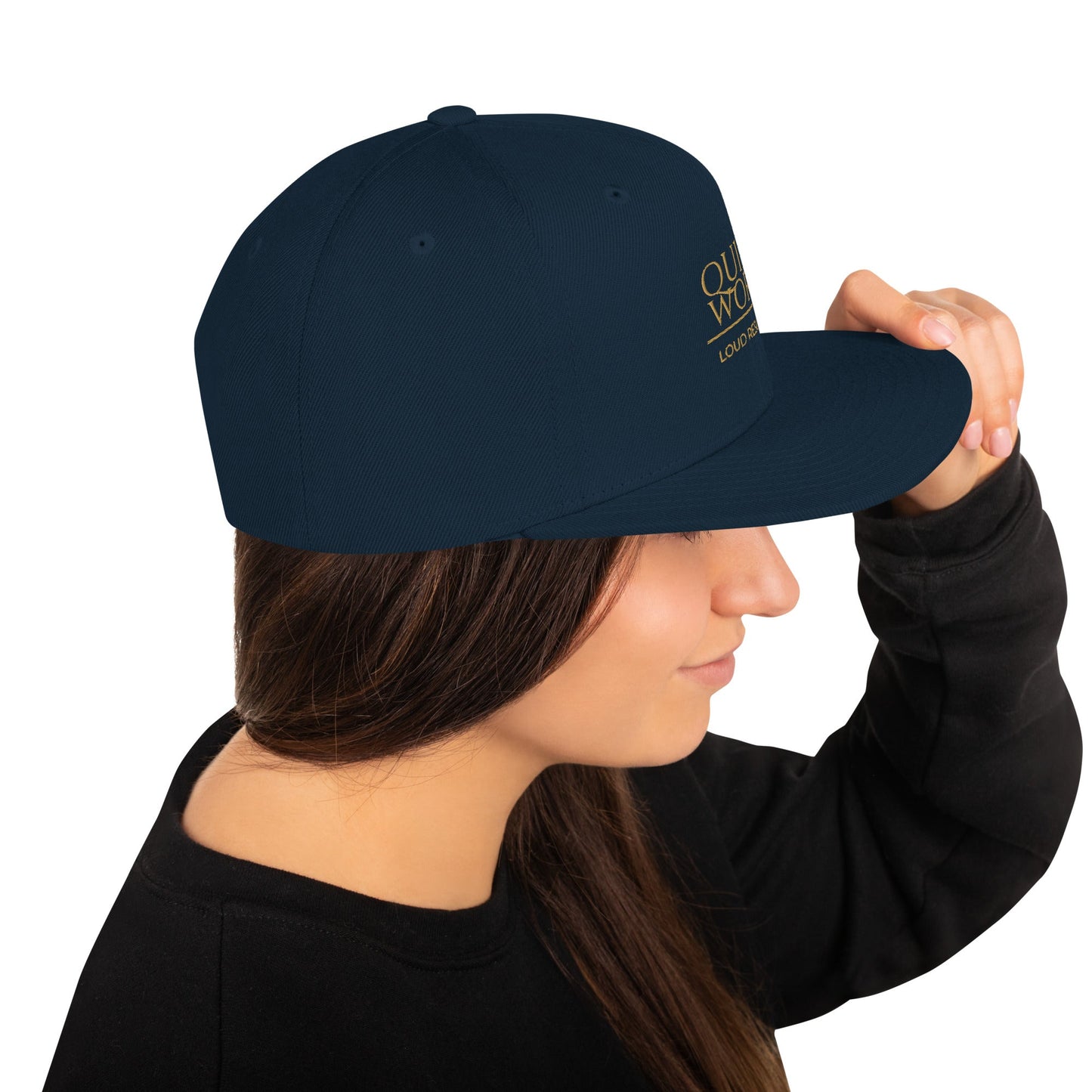 Dark navy snapback cap, angled side view with crown logo print
