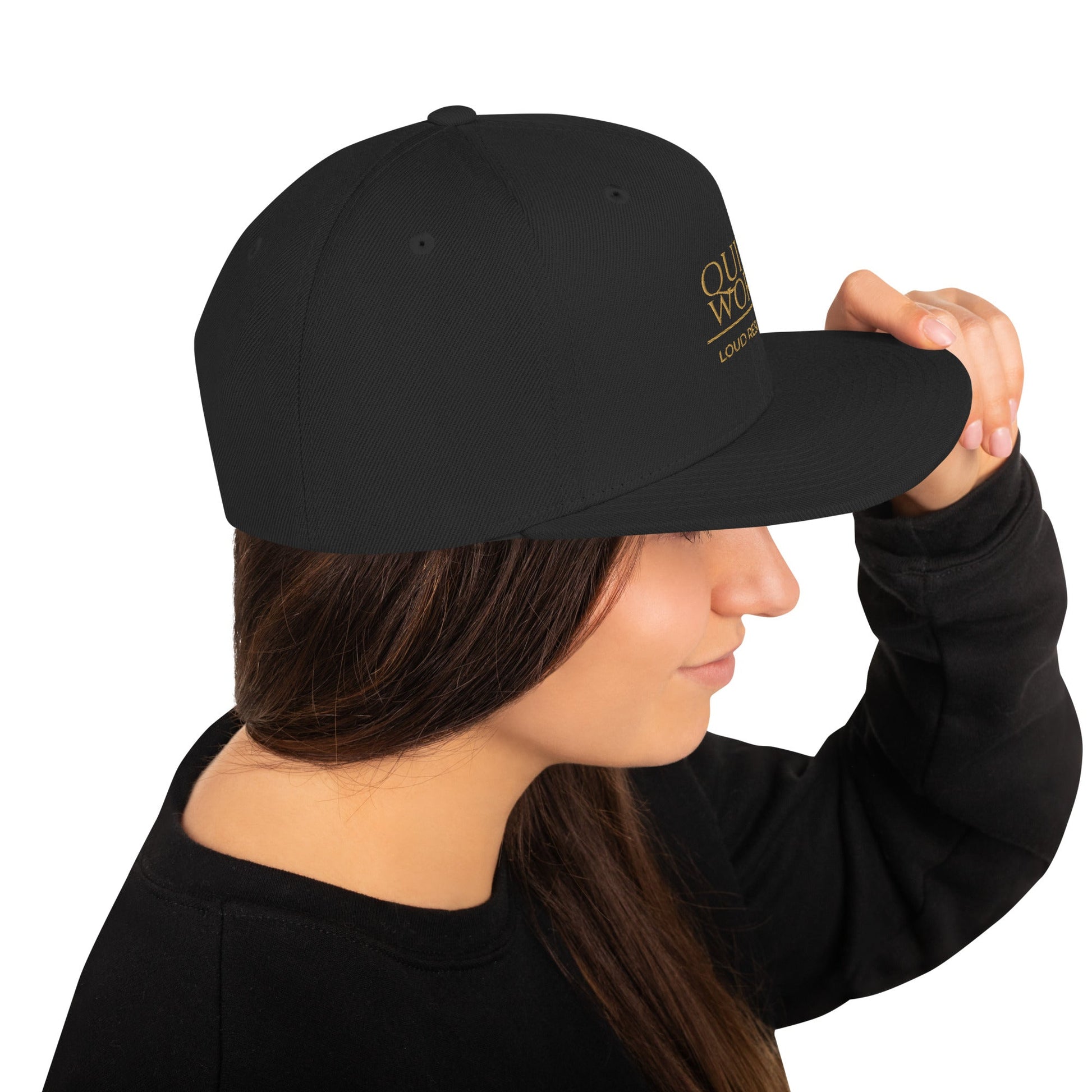 Black snapback cap, angled side view with crown logo print